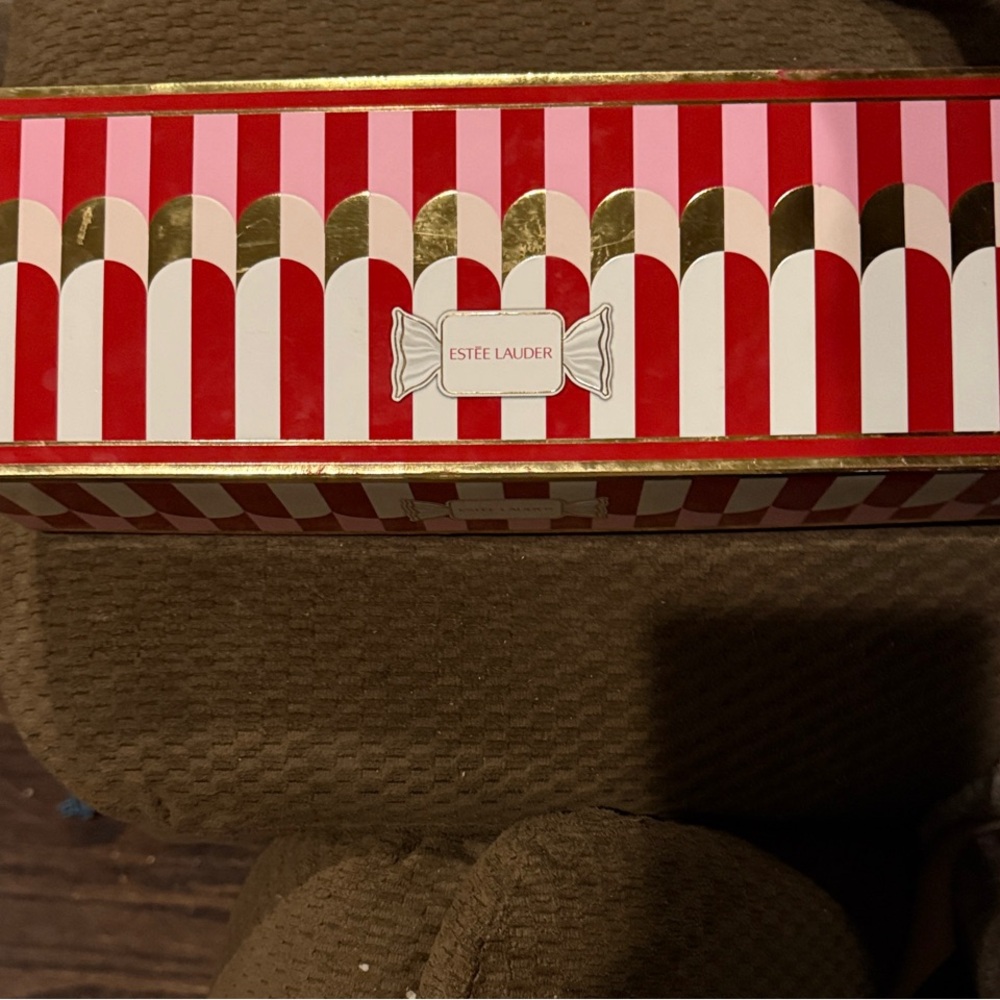 Estee Lauder Red and Gold Candy Stripe Box of night repair creams.